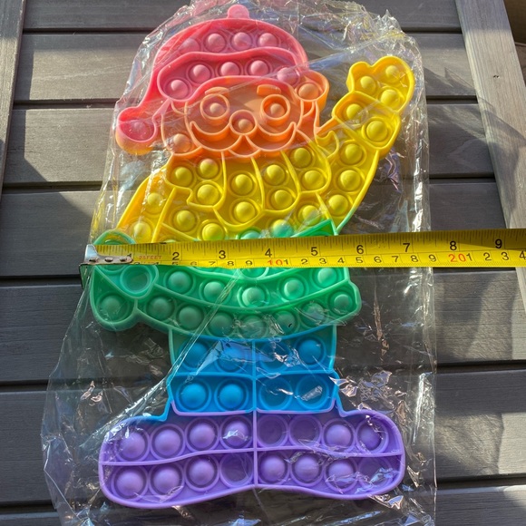 xlarge pastel colored Santa Christmas fidget pop toy 12x7 - Picture 3 of 3